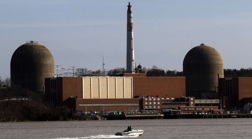A boat moves along the Hudson River in front of the Indian Point nuclear power plant March 18, 2011 in Buchanan, New York.