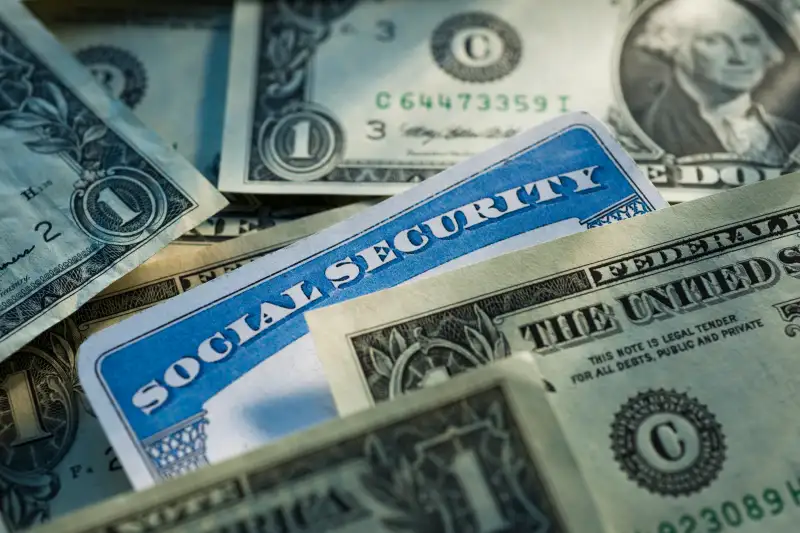 Studio shot of social security card and banknotes