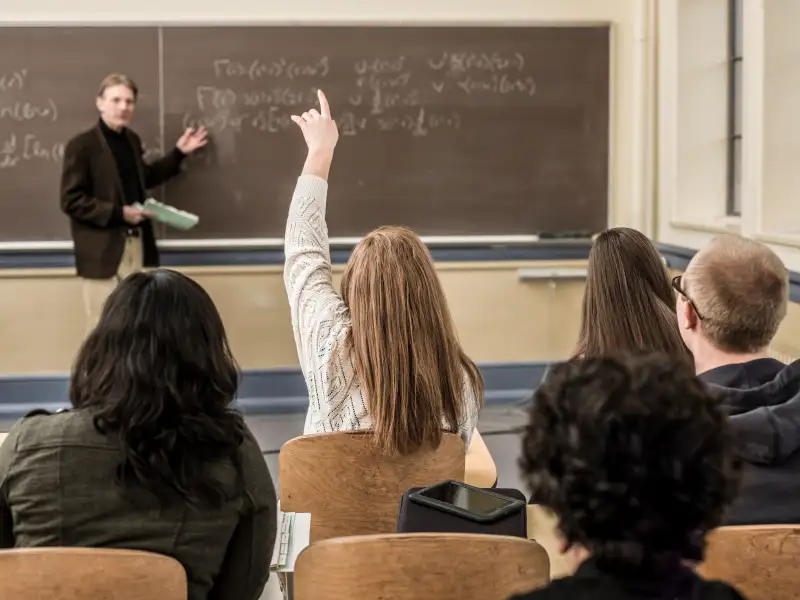 Teacher talking to students in classroom