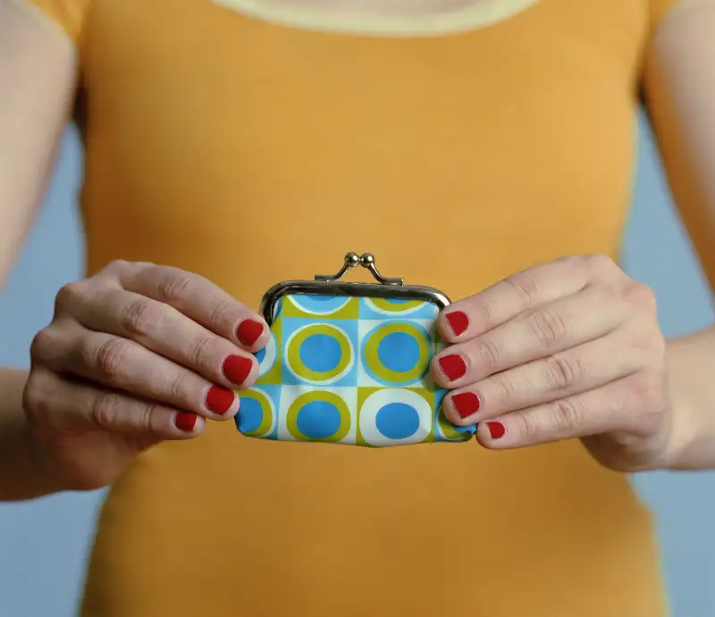 Woman holding purse, close-up