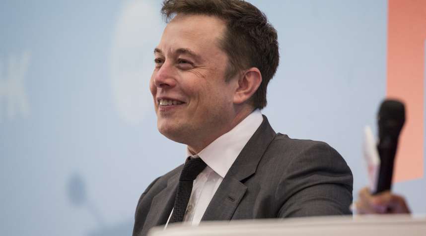 Billionaire Elon Musk, chief executive officer of Tesla Motors Inc., reacts during the StartmeupHK Venture Forum in Hong Kong, China, on Tuesday, Jan. 26, 2016. Tesla is looking for a Chinese production partner but is  still trying to figure that out,  Musk said. Photographer: Justin Chin/Bloomberg via Getty Images