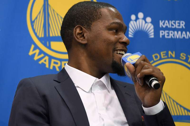 Kevin Durant speaks to the media during the press conference where he was introduced as a member of the Golden State Warriors after they signed him as a free agent on July 7, 2016 in Oakland, California.