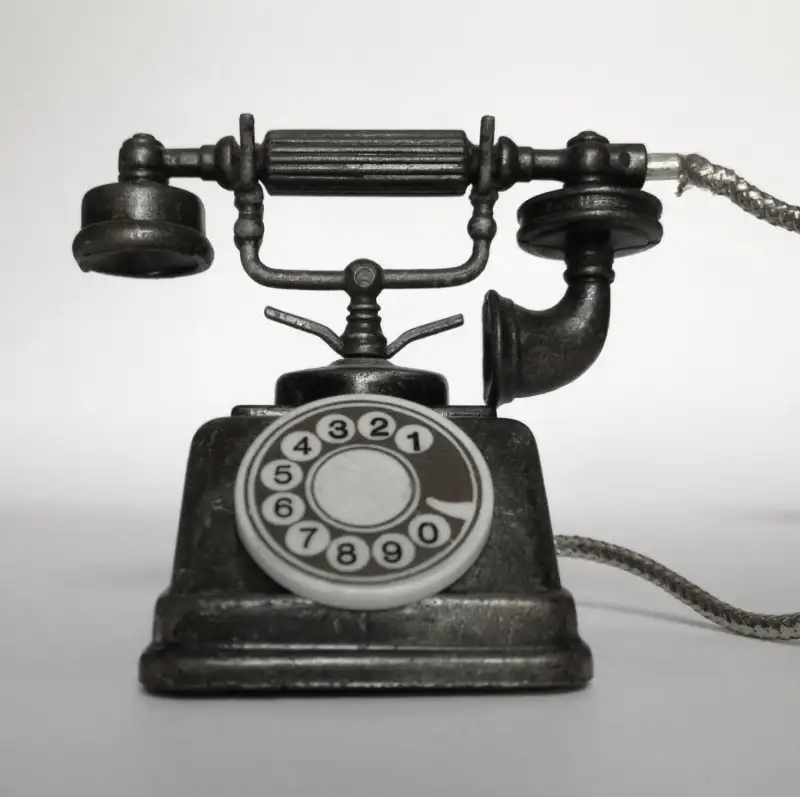 Vintage Telephone On Table Against Wall