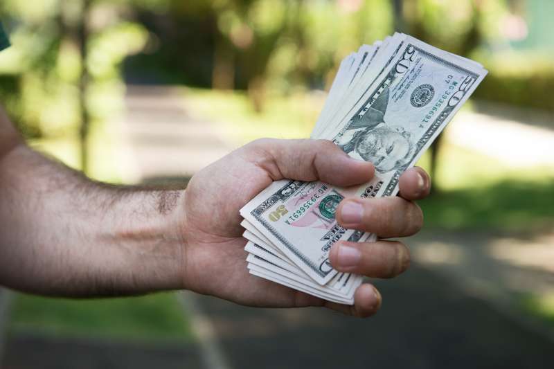 Dollars in a man's hand