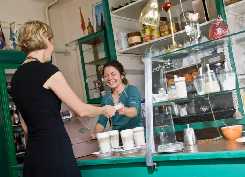 Female barista helping a female customer