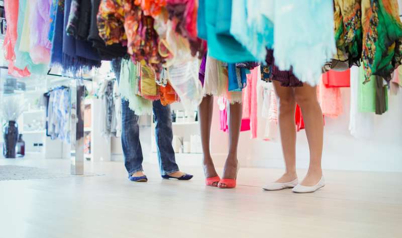 Women shopping together in clothing store