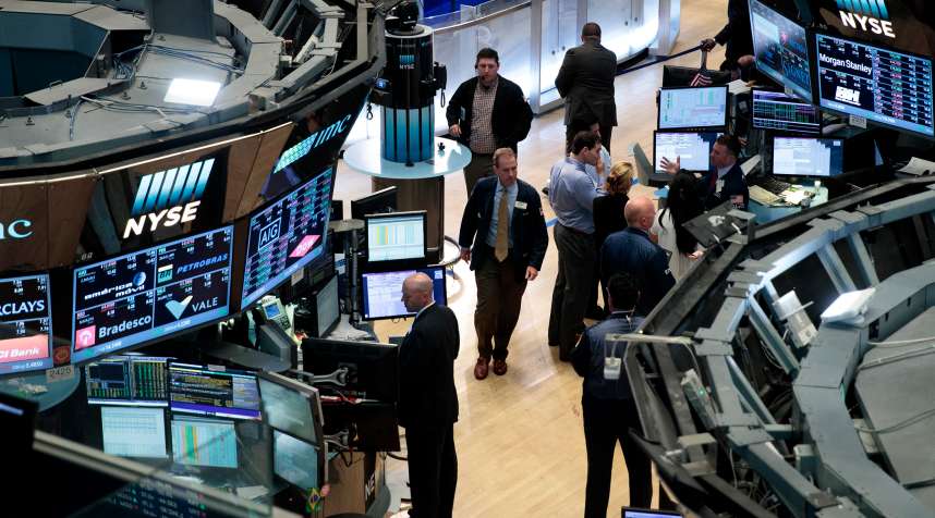 Traders and other financial professionals work on the floor of the New York Stock Exchange last month.