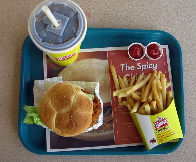 A spicy chicken combo meal is shown at a Wendy's restaurant.
