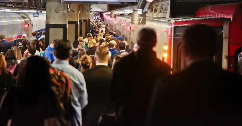 Commuters board a Metro-North train at Grand Central Terminal, May 18, 2016, in New York.