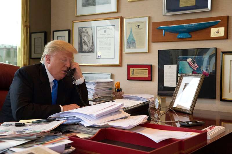 Republican presidential candidate Donald Trump takes a telephone call from his daughter Ivanka during an interview with The Associated Press in his office at Trump Tower in New York, May 10, 2016.