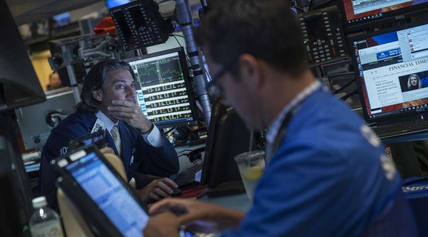 Traders work on the floor of the New York Stock Exchange (NYSE) in New York, on Aug. 4, 2016.