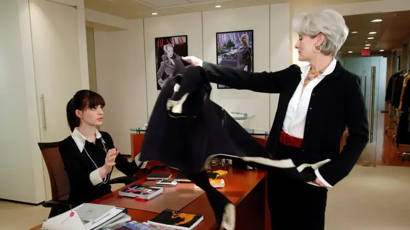 Anne Hathoway as “Andie” and Meryl Streep as “Miranda Priestley” in THE DEVIL WEARS PRADA (2006)