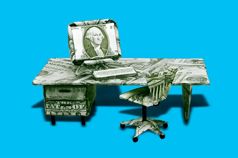 office chair and desk made out of money.