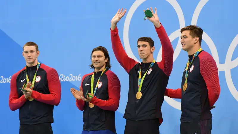 From left to right, United States' Ryan Murphy, Cody Miller, Michael Phelps and Nathan Adrian stand for the medal ceremony for the men's 4 x 100-meter medley relay final during the swimming competitions at the 2016 Summer Olympics, Sunday, Aug. 14, 2016, in Rio de Janeiro, Brazil.