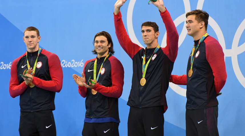 From left to right, the U.S.'s Ryan Murphy, Cody Miller, Michael Phelps and Nathan Adrian stand for the medal ceremony for the men's 4 x 100-meter medley relay in Rio.