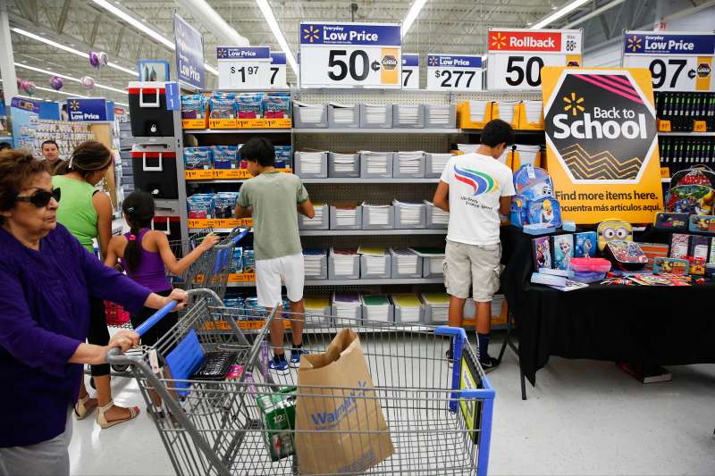 Customers browse school supplies at a Wal-Mart Stores Inc. location in the Porter Ranch neighborhood of Los Angeles, on August 6, 2015.