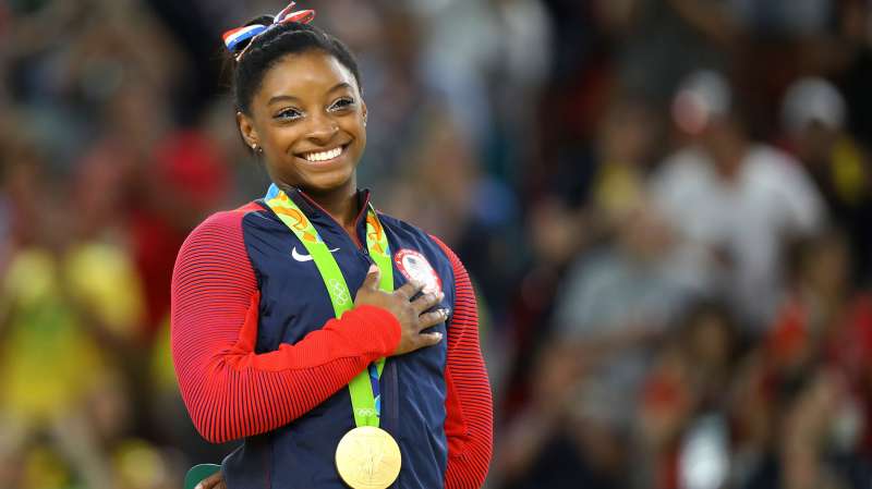 Gold medalist Simone Biles (USA) of USA places her hand on her heart as her national anthem is played after the Women’s Floor Final in the 2016 Rio Olympics, Rio Olympic Arena, Rio de Janeiro, Brazil, August 16, 2016.
