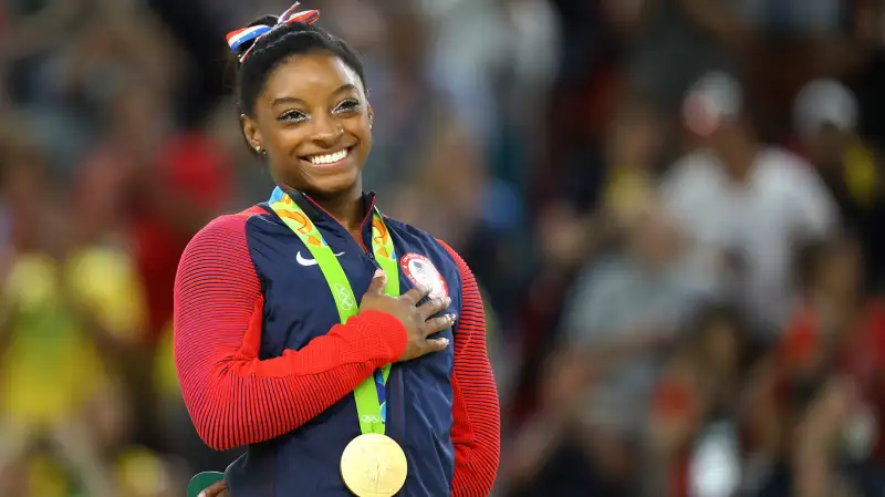 Gold medalist Simone Biles (USA) of USA places her hand on her heart as her national anthem is played after the Women’s Floor Final in the 2016 Rio Olympics, Rio Olympic Arena, Rio de Janeiro, Brazil, August 16, 2016.