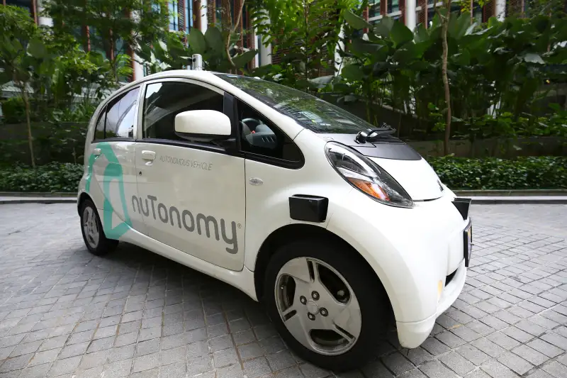 An autonomous vehicle is parked for its test drive in Singapore Wednesday, Aug. 24, 2016. The world’s first self-driving taxis, operated by nuTonomy, an autonomous vehicle software startup, will be picking up passengers in Singapore starting Thursday, Aug. 25. The service will start small - six cars now, growing to a dozen by the end of the year. The ultimate goal, say nuTonomy officials, is to have a fully self-driving taxi fleet in Singapore by 2018, which will help sharply cut the number of cars on Singapore’s congested roads.
