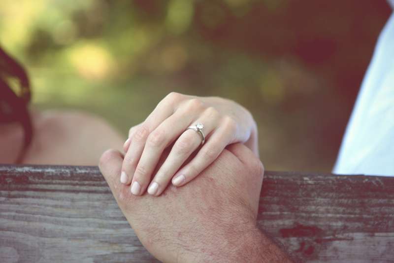 Young Couples' Hands with Engagement Ring