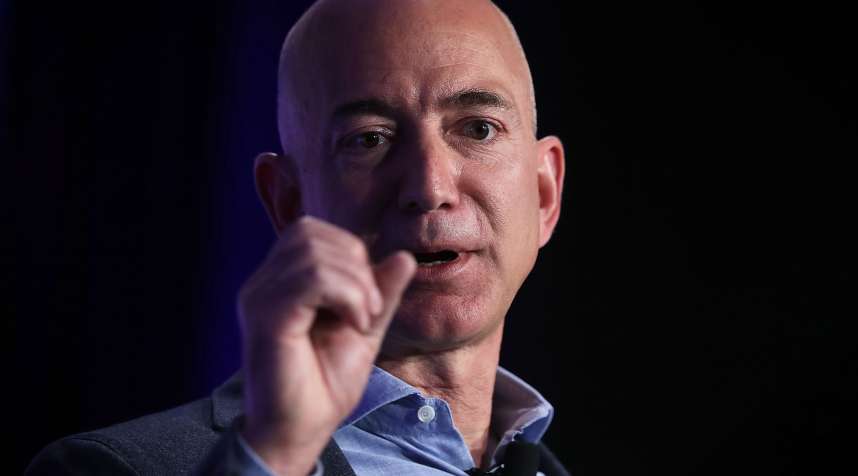 Tech stocks like Amazon, whose CEO Jeff Bezos is pictured above, are helping investors turn a profit on their portfolios.