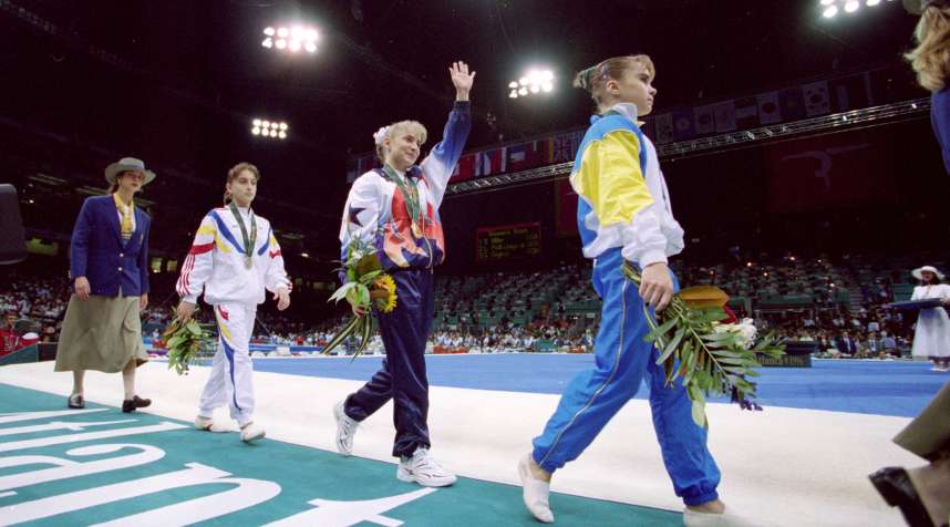 29 Jul 1996: Shannon Miller of the USA waves to the crowd as she wins the Gold medal in the Uneven Bars at the Georgia Dome in the 1996 Olympic Games in Atlanta, Georgia.