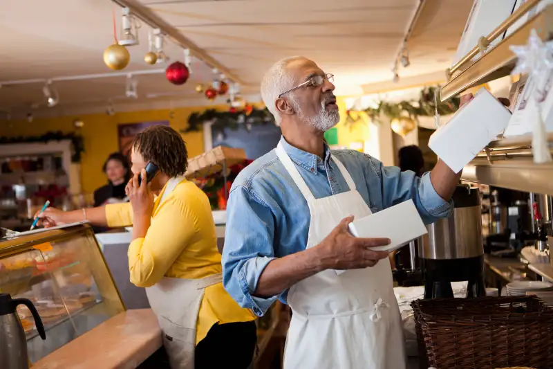 Small business owners working in bakery together