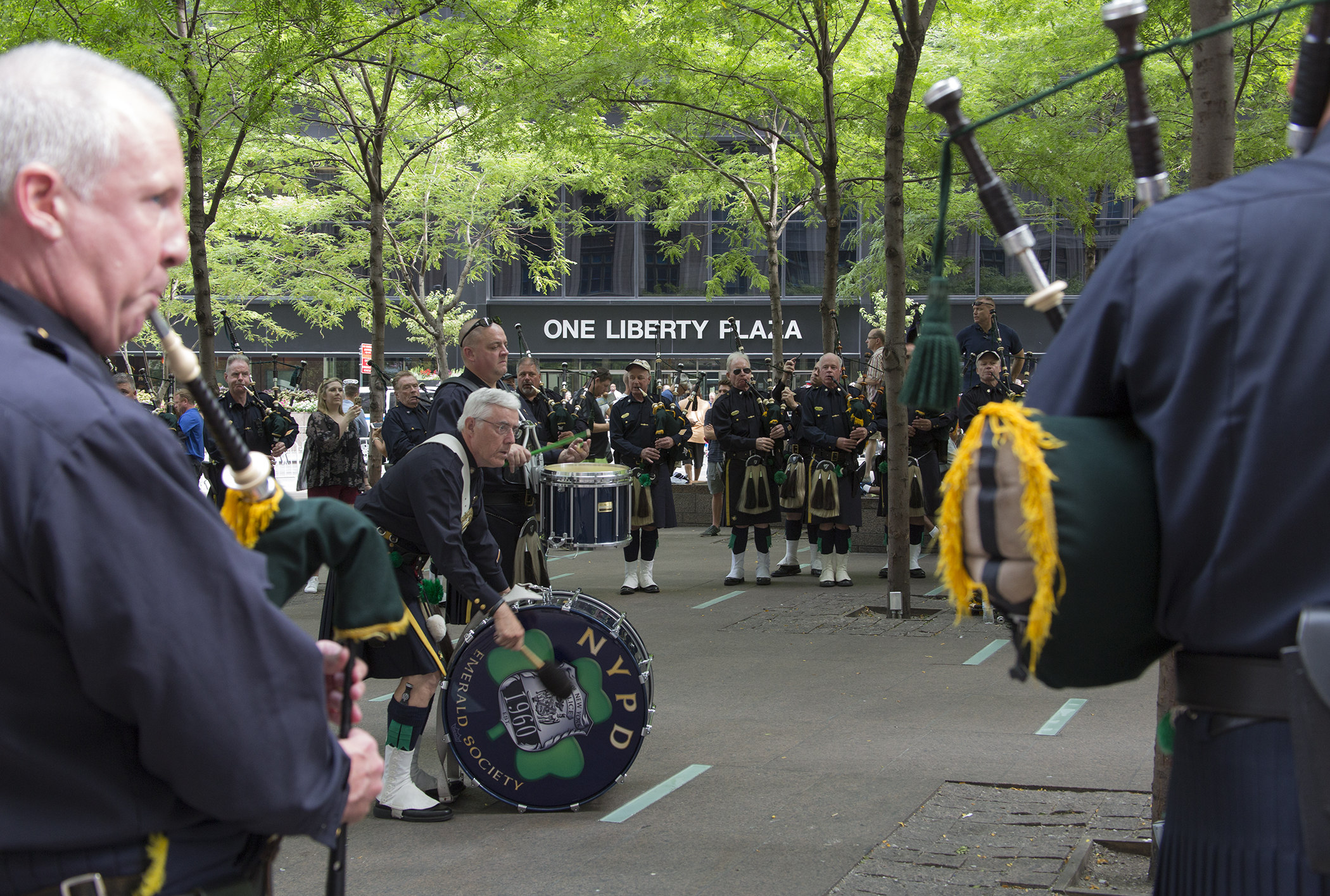 Members of NYPD Emerald Society Pipes and Drums practice in Zucotti Park, September 9, 2016.