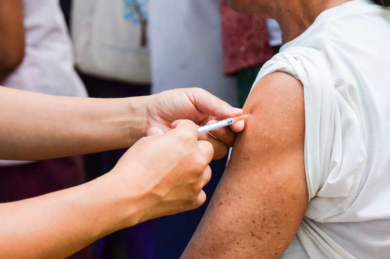person giving vaccination