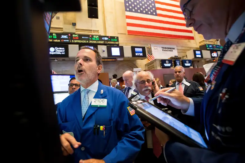 Traders work on the floor of the New York Stock Exchange in New York, on Sept. 9, 2016.