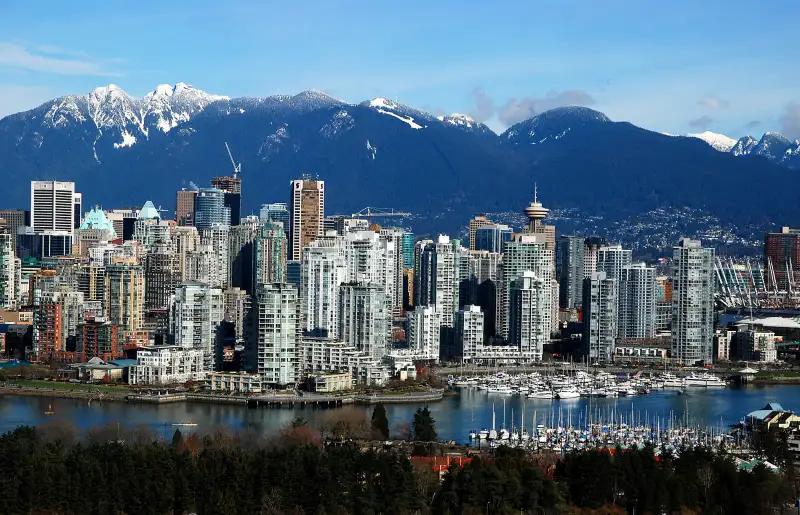 Vancouver with False Creek in foreground and Grouse Mountain and the North Shore Mountains in background