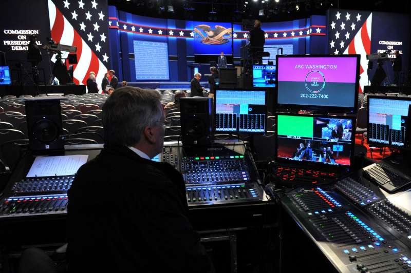 A TV technician is seen by the stage of the first presidential debate at Hofstra University's David &amp; Mack Sport and Exhibition Complex in Hempstead, New York on September 26, 2016. The first US presidential debate, between Democratic candidate Hillary Clinton and Republican Donald Trump, is one of the high points of the campaign, six weeks from the November 8 elections. This first of three nationally televised debates will give the candidates a chance to introduce themselves to skeptical American voters who will be watching closely for the slightest misstep, awkward gesture or fatal altercation.