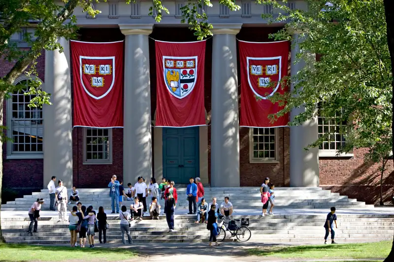 Harvard banners hang outside Memorial Church on the Harvard University campus in Cambridge, Massachusetts.