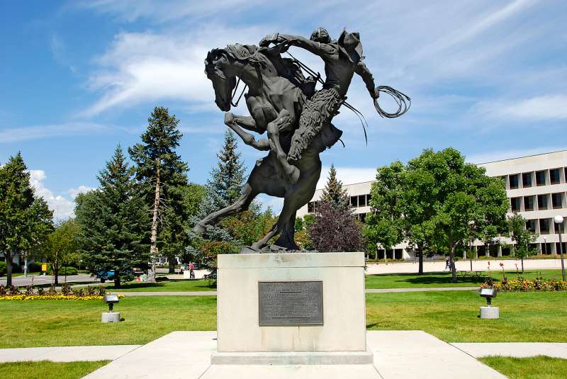 Statue monument of cowboy on a horse to the citizens of Wyoming at The State Capitol Building at Cheyenne Wyoming WY