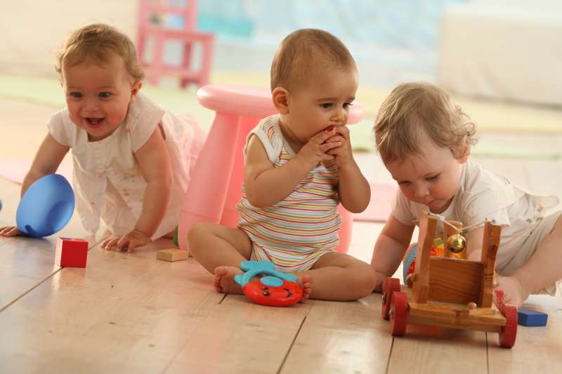 Three little children playing together