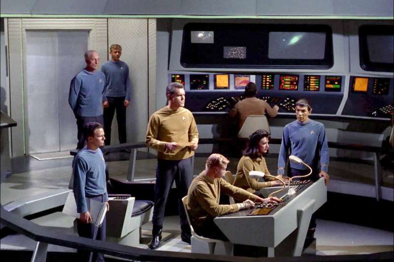LOS ANGELES - DECEMBER 1: The crew on the bridge of the USS Enterprise.  John Hoyt as Dr. Phillip Boyce standing in back with hands behind his back, Jeffrey Hunter as Captain Christopher Pike, center holding paper, Peter Duryea as Lieutenant Jos? Tyler, seated left, Majel Barrett as Number One (M. Leigh Hudec)seated right and Leonard Nimoy as Commander Spock (Mr. Spock) standing left. in the STAR TREK: The Original Series episode,  The Cage.  This is the pilot episode completed early 1965, but not broadcast until October 4, 1988.   Image is a screen grab. (Photo by CBS via Getty Images)