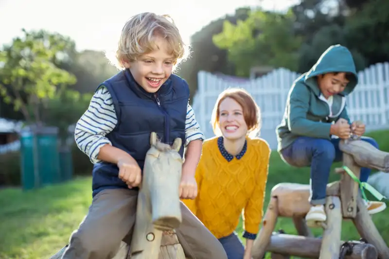 Teacher and students playing outdoors