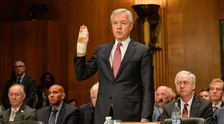 Wells Fargo's chairman and chief executive officer John Stumpf swears an oath before the U.S. Senate Banking Committee on Capitol Hill in Washington D.C. on Sept 20, 2016. U.S. lawmakers grilled Stumpf on Tuesday over the bank's fake account scandal as he declined to support clawing back executive compensation.