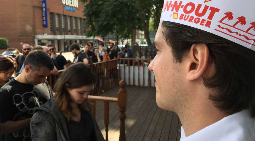 Southern Californian burger chain ‘In-n-Out Burger’ open a pop up restaurant in Swiss Cottage, London. Burger fans were queuing from 9 am for a chance to experience the cult burger.