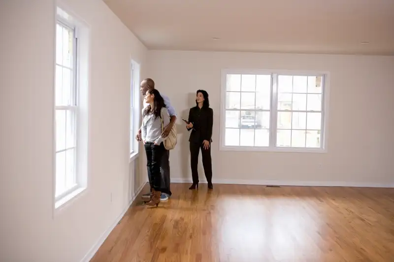 Realtor showing couple new home