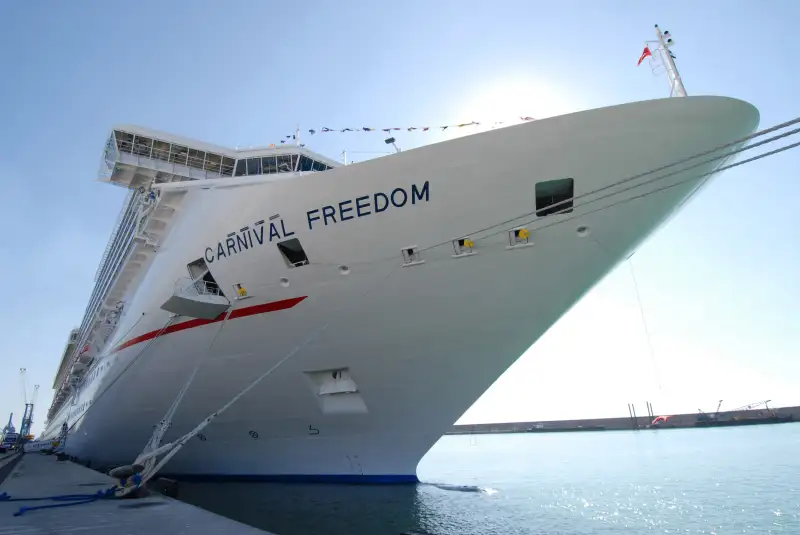 The Carnival cruise ship Freedom sits docked at the port o