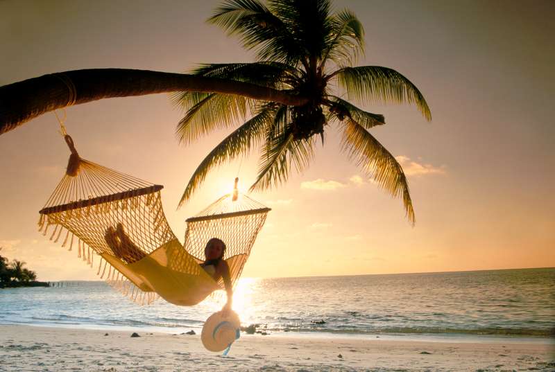 Woman in Hammock at Sunset