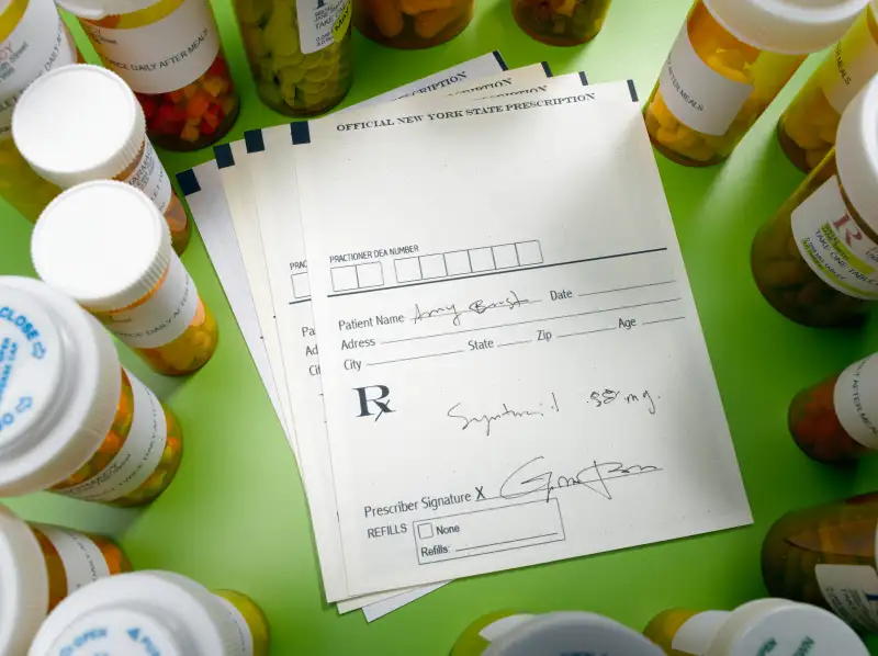 Prescription slip and pill bottles