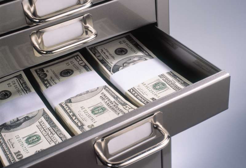 Steel drawer filled with packets of US banknotes