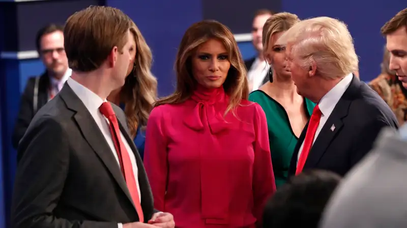 Republican U.S. presidential nominee Donald Trump talks with his son Eric (L), wife Melania (C) and daughter Ivanka (R, rear) at the conclusion of the debate with Democratic U.S. presidential nominee Hillary Clinton at Washington University in St. Louis, October 9, 2016.