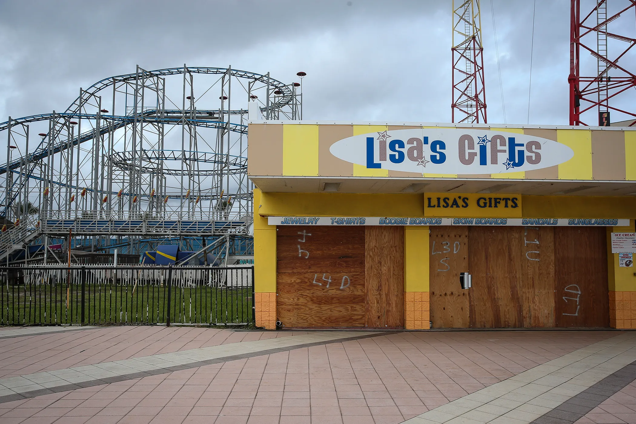 Lisa's Gifts at the Daytona Beach Boardwalk and Pier stands closed and boarded up ahead of Hurricane Matthew in Daytona Beach, Fla. on Oct. 6, 2016.  