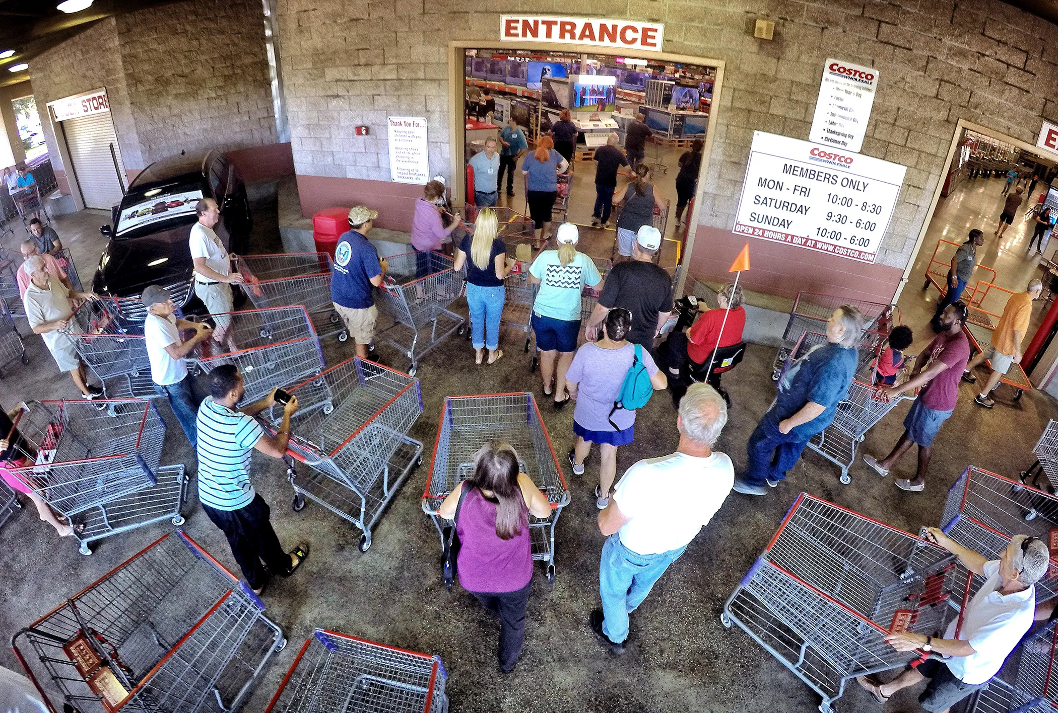 Shoppers crowd the entrance to the Costco store on Oct. 5, 2016 in Altamonte Springs, Fla,. as central Floridians prepare for the anticipated strike of Hurricane Matthew.