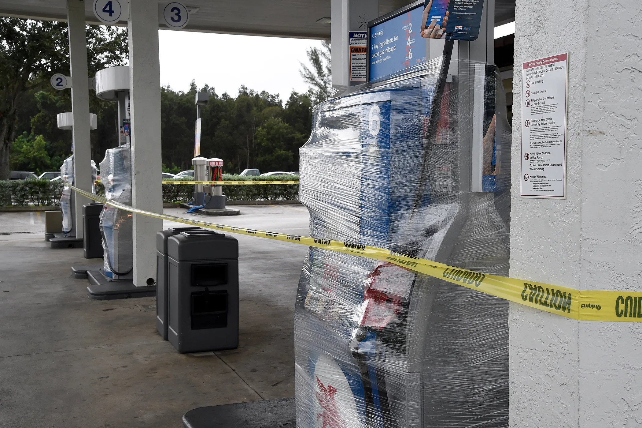 A gas station's pumps are wrapped and closed as many stations in south Florida are out of gas in Miami, Florida on October 6, 2016.