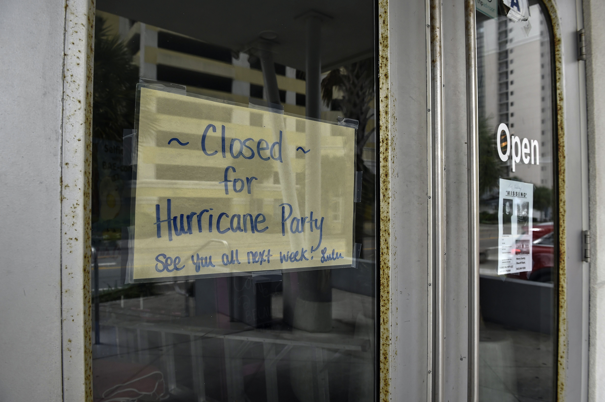 A sign is seen in the door of a cafe in Myrtle Beach, South Carolina on October 6, 2016 as Hurricane Matthew makes its way towards the United States.