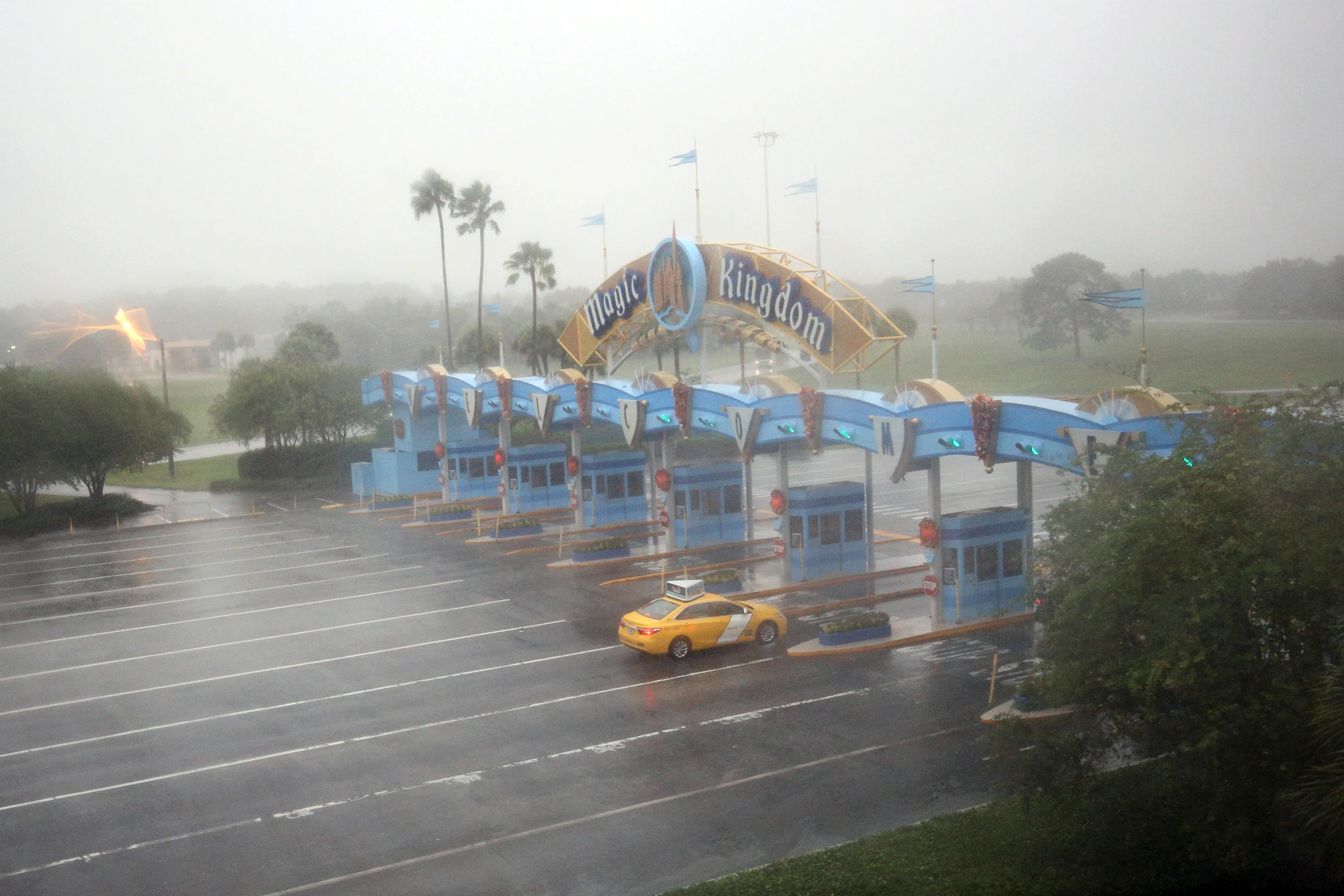 A lone taxi heads toward the Walt Disney World Resort area in Orlando, Florida, before the landfall of Hurricane Matthew, on October 6, 2016.